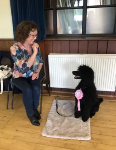 A woman with her dog in a group dog training class in Ockley, near Dorking.